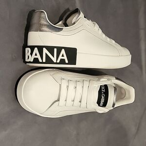 Dolce & Gabbana sneakers, size 7.5, white with red stitching.